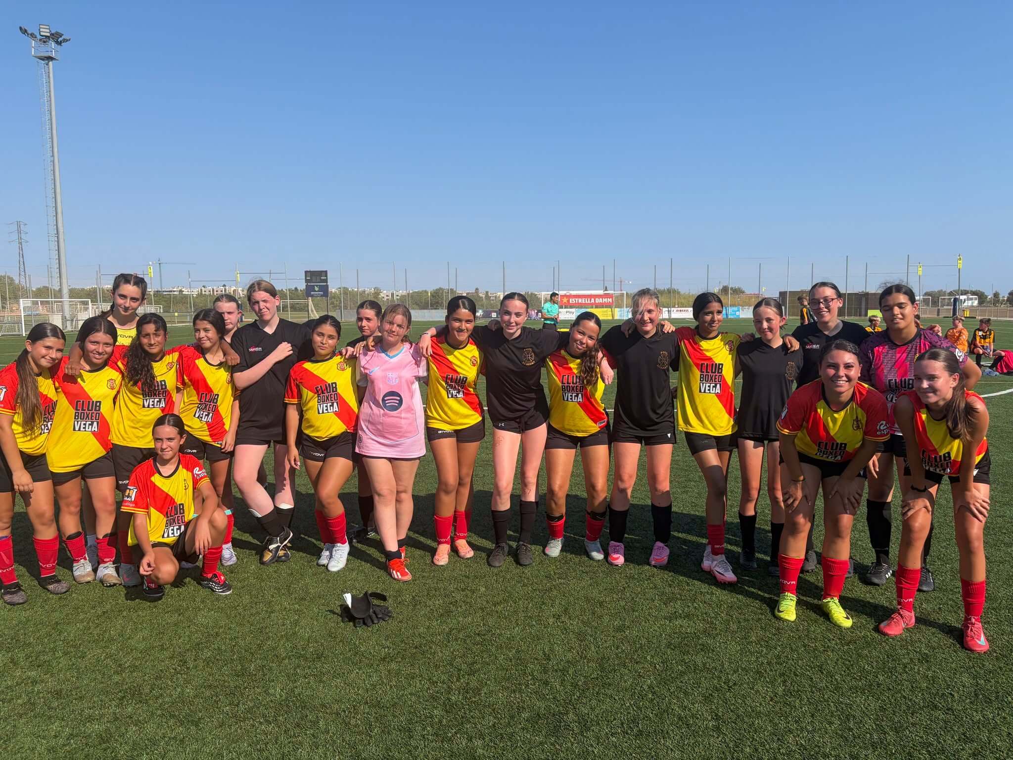 The girls' team bond with their Spanish opposition