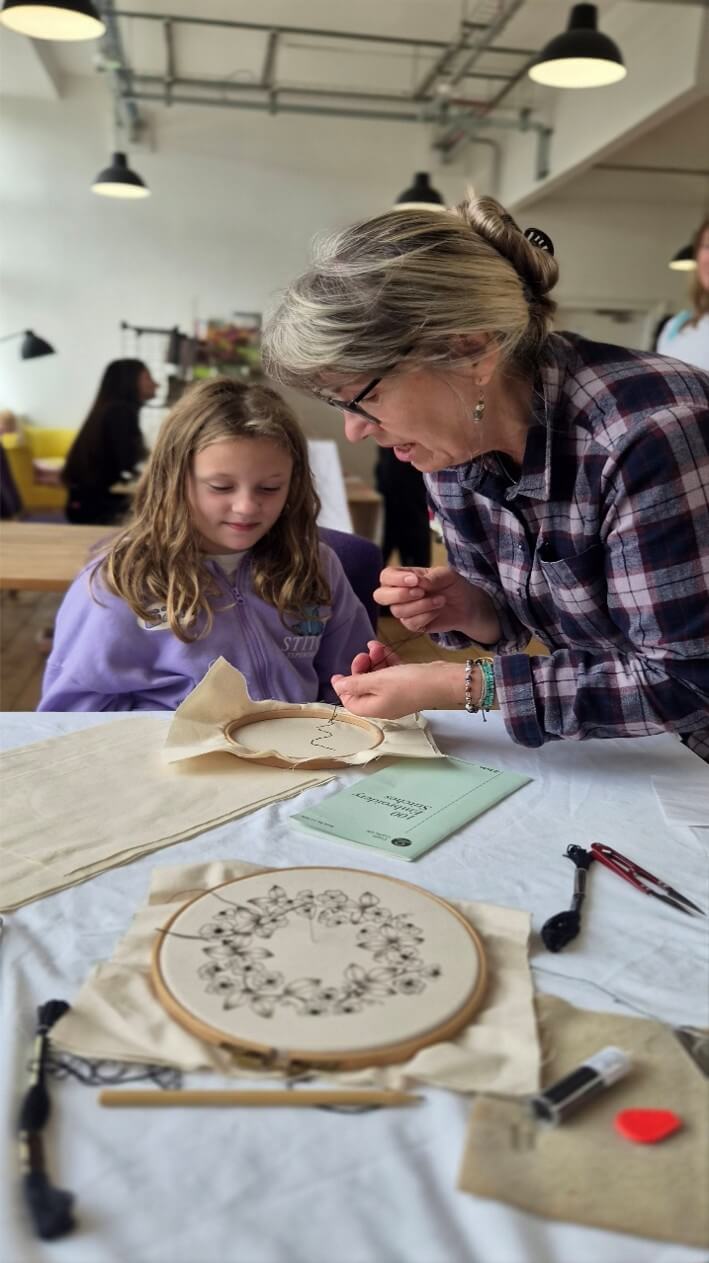 Tina Heath demonstrating embroidery
