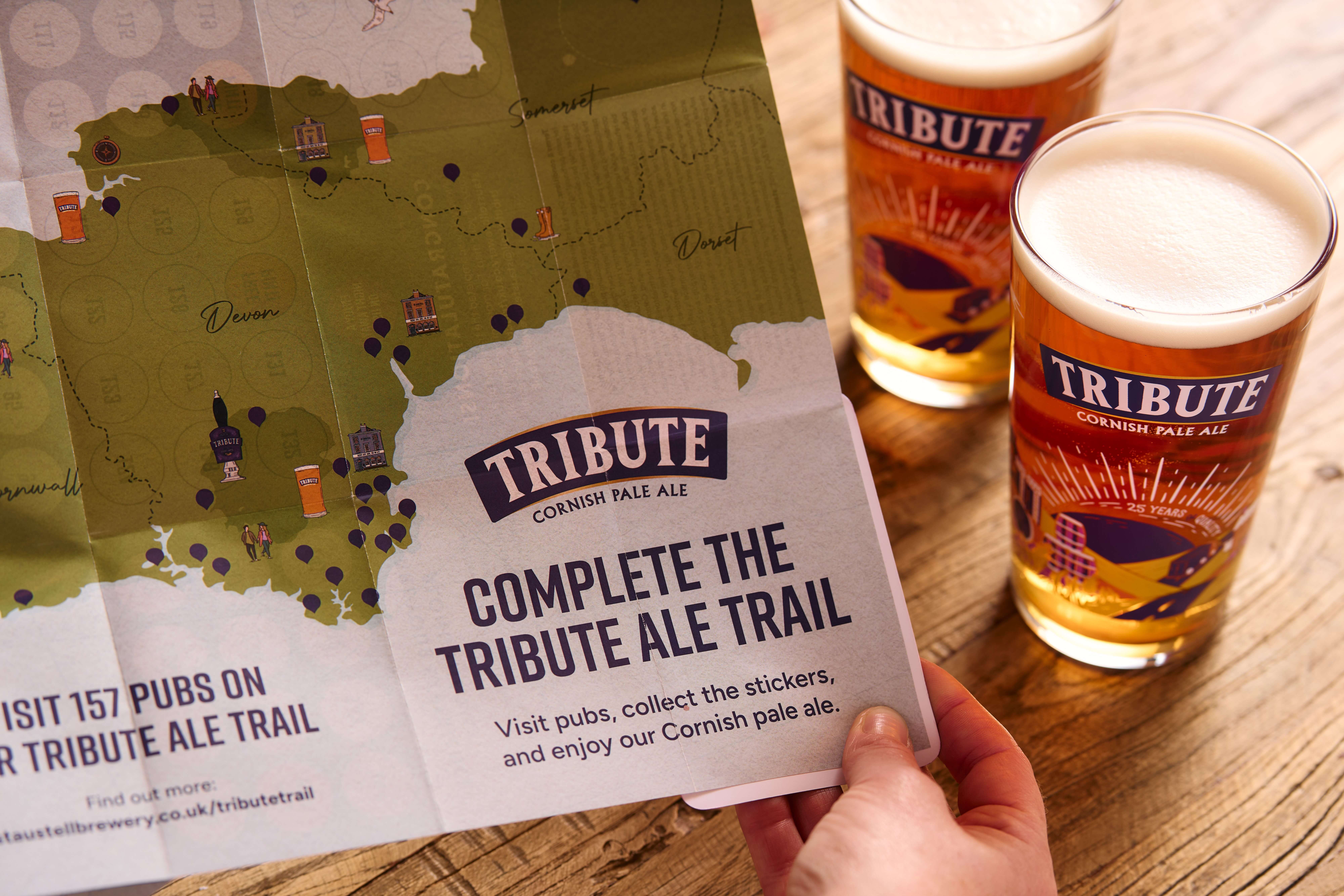 The Tribute Ale Trail map alongside two pints of Tribute