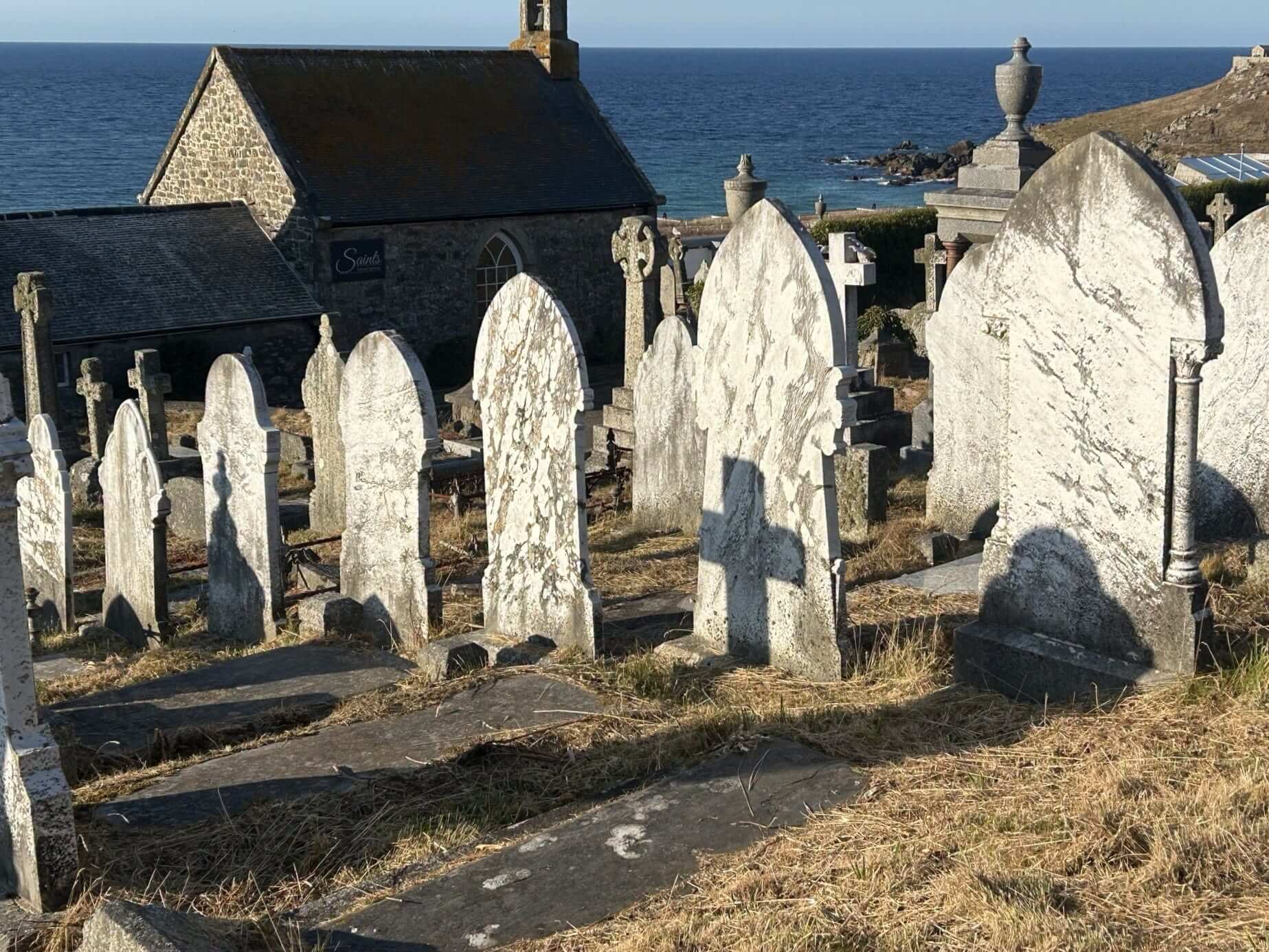 Gravestones at Barnoon Cemetery in St Ives overlooking the sea