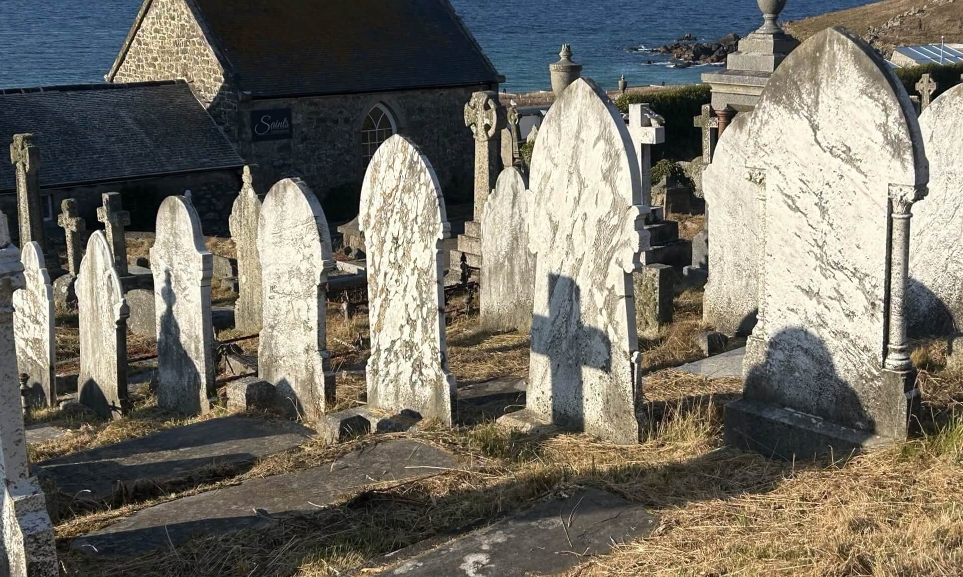 Gravestones at Barnoon Cemetery in St Ives overlooking the sea