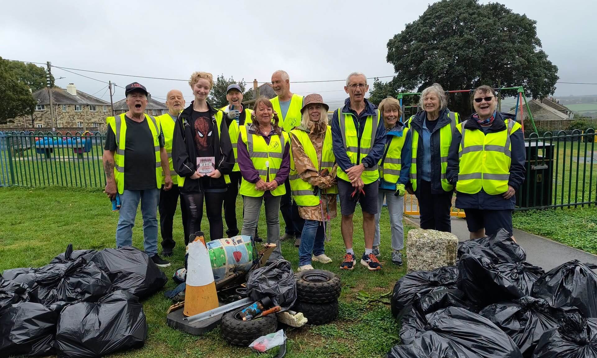 Bodmin Tidy it Team volunteers with bags of collected litter at Fair Park