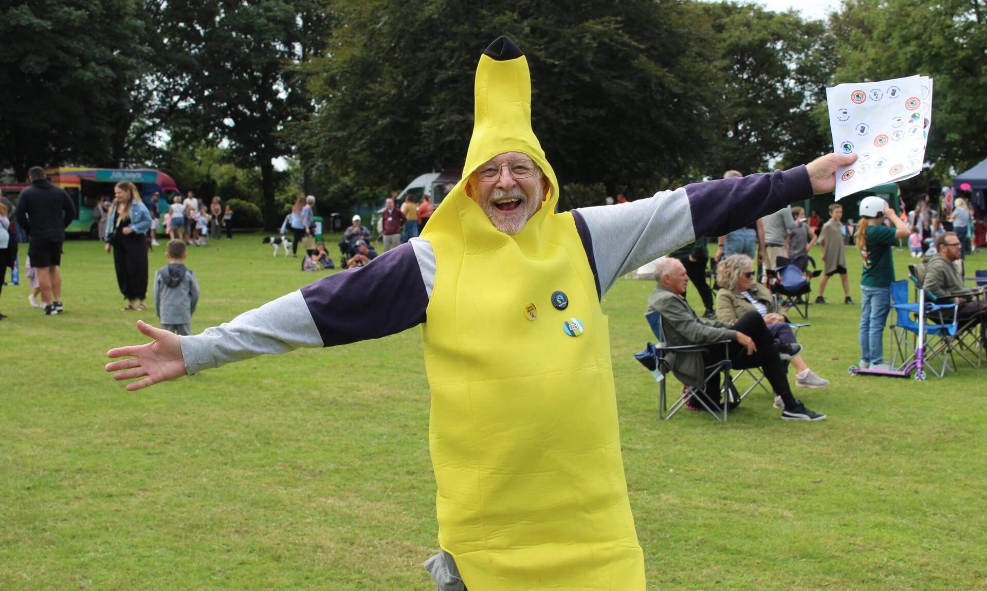 Man in a giant banana costume with arms outstretched at Camborne Green Fest