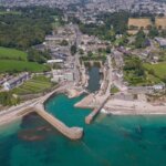 Aerial view of Charlestown Harbour with its inner basin, piers and turquoise sea