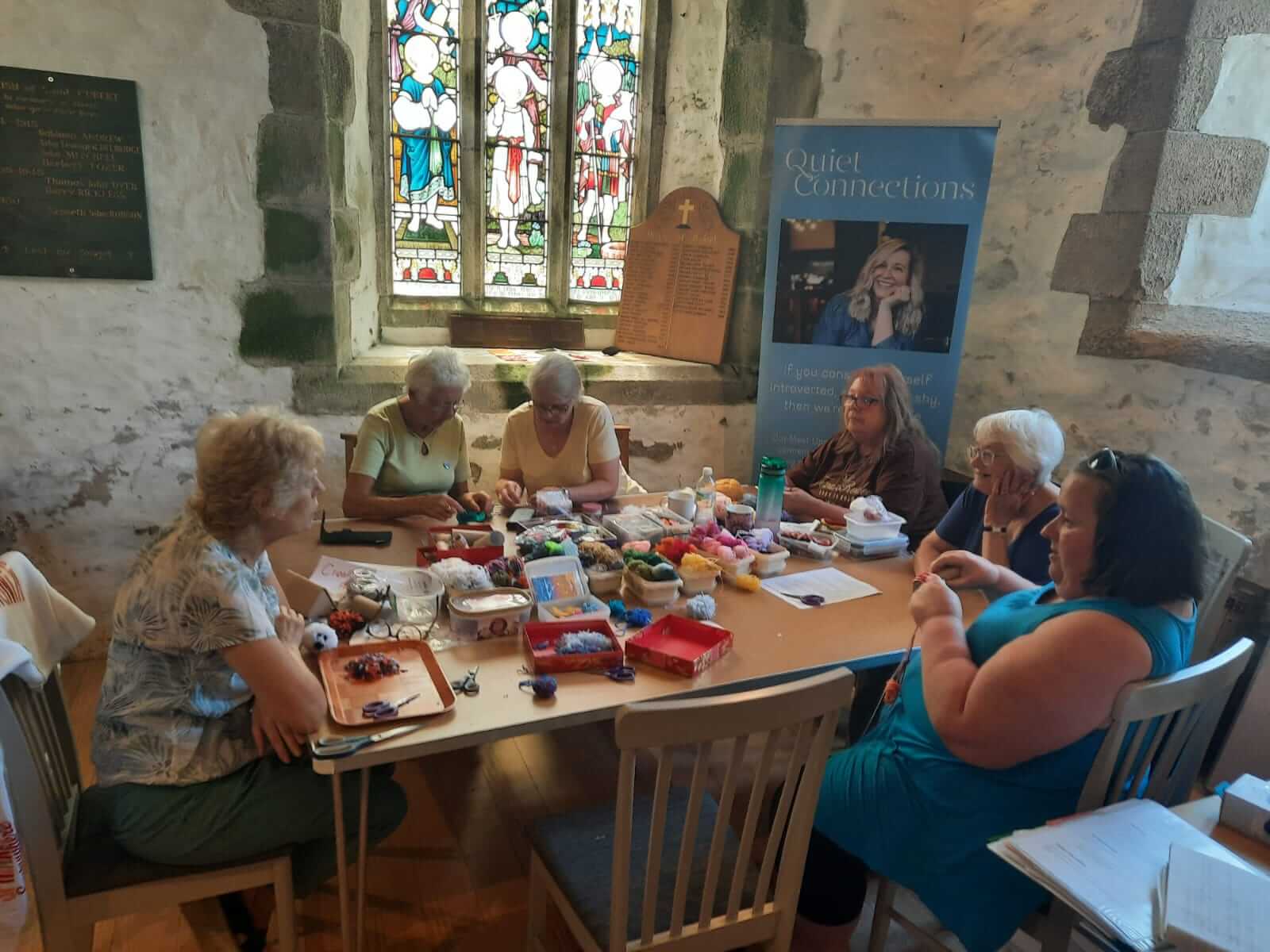 A community craft table during HushFest at St Cubert Church