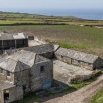 Aerial view of the granite barns at Portheras Farm Buildings, Pendeen