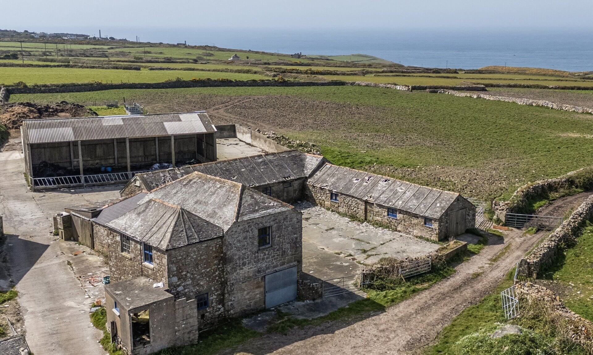 Aerial view of the granite barns at Portheras Farm Buildings, Pendeen