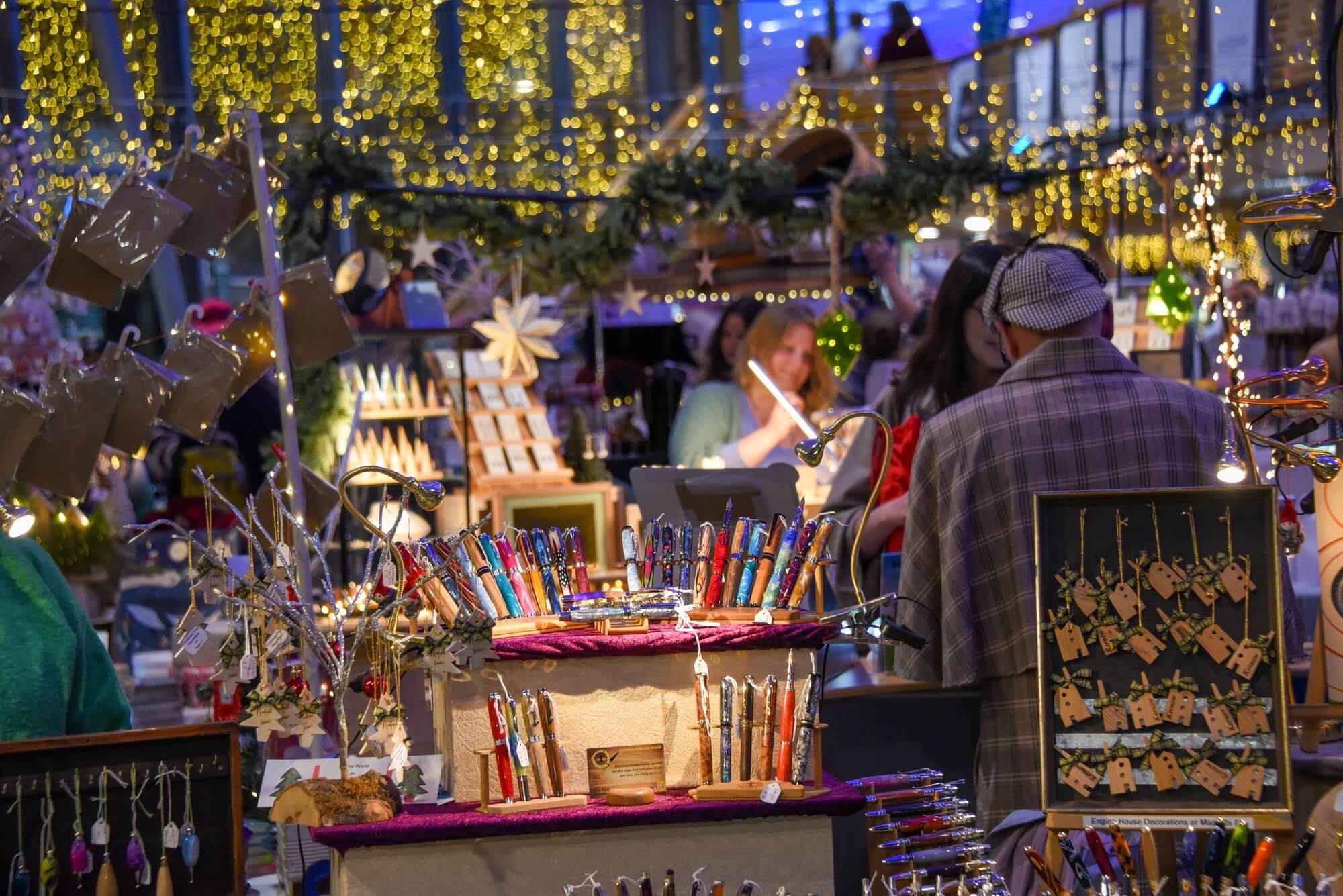 Stalls lit up in the evening at the Cornwall Christmas Fair