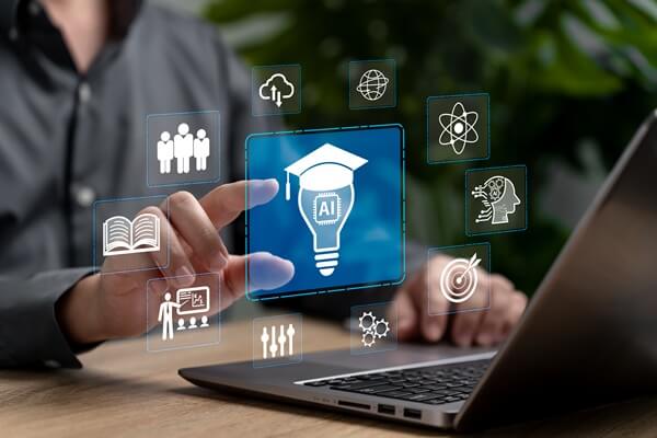 AI and technical education icons overlaid on a laptop, illustrating Cornwall College Group's support for teaching AI from Year 10