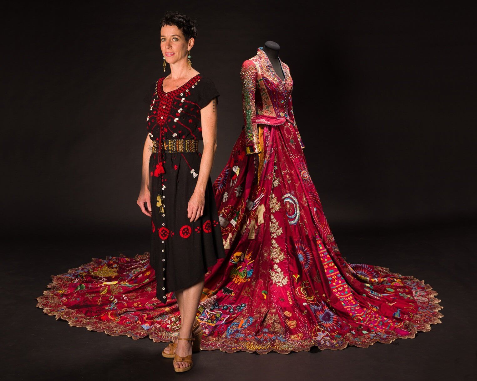 Artist Kirstie Macleod standing beside The Red Dress