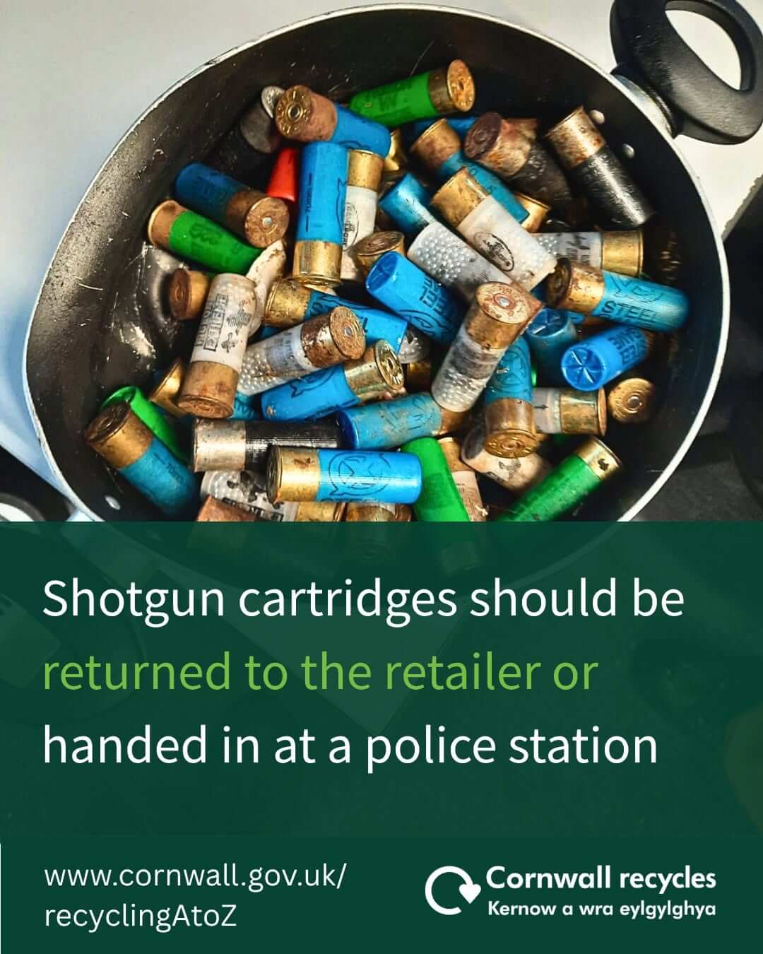 Pan of used shotgun cartridges with a Cornwall Recycles message saying they should be returned to the retailer or handed in at a police station
