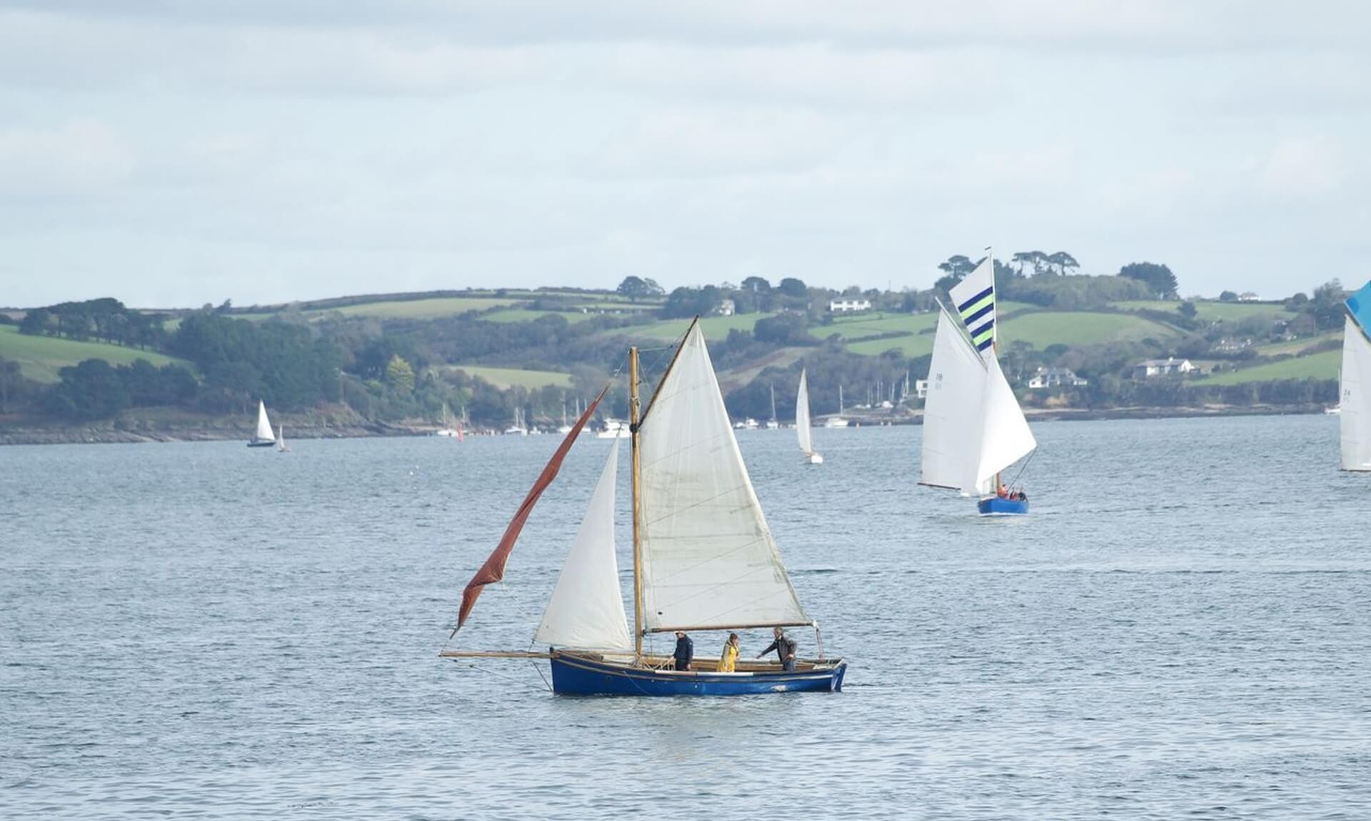 A Falmouth Working Boat under sail on the Carrick Roads during Falmouth Oyster Festival