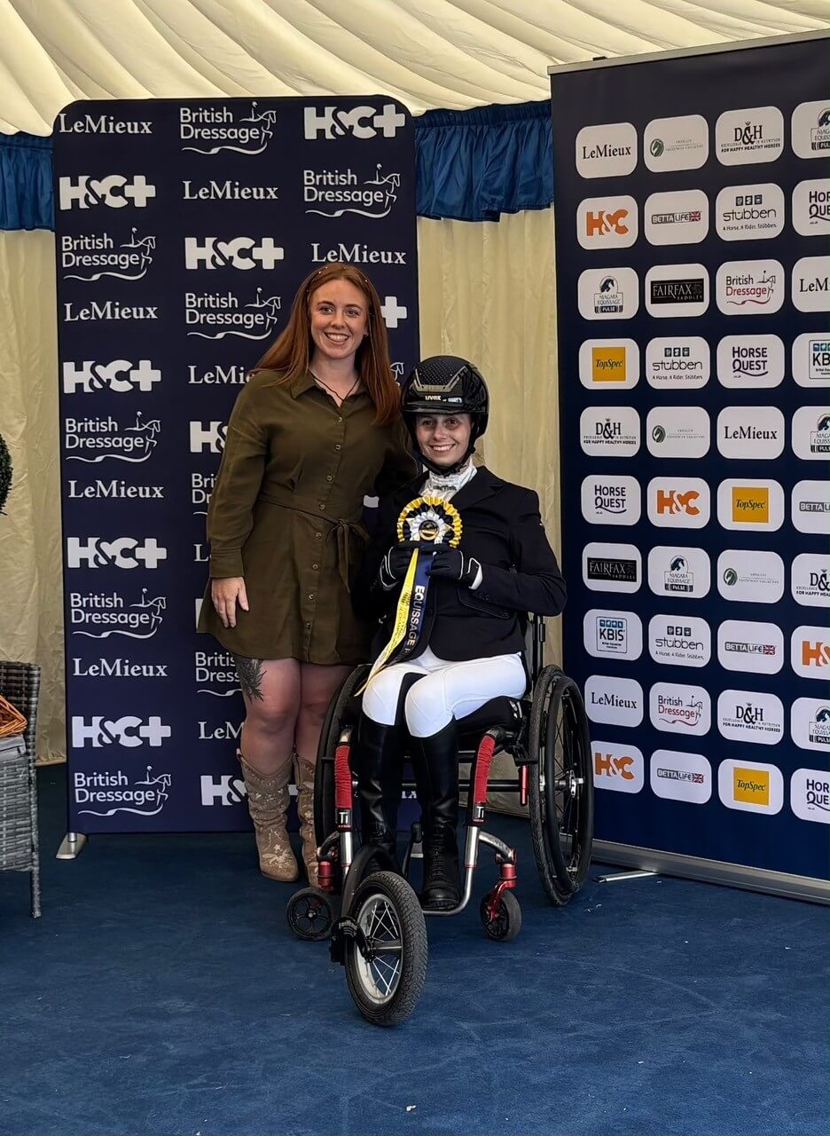 Flis Marriott with a GSF representative and her Grade 1 Gold rosette