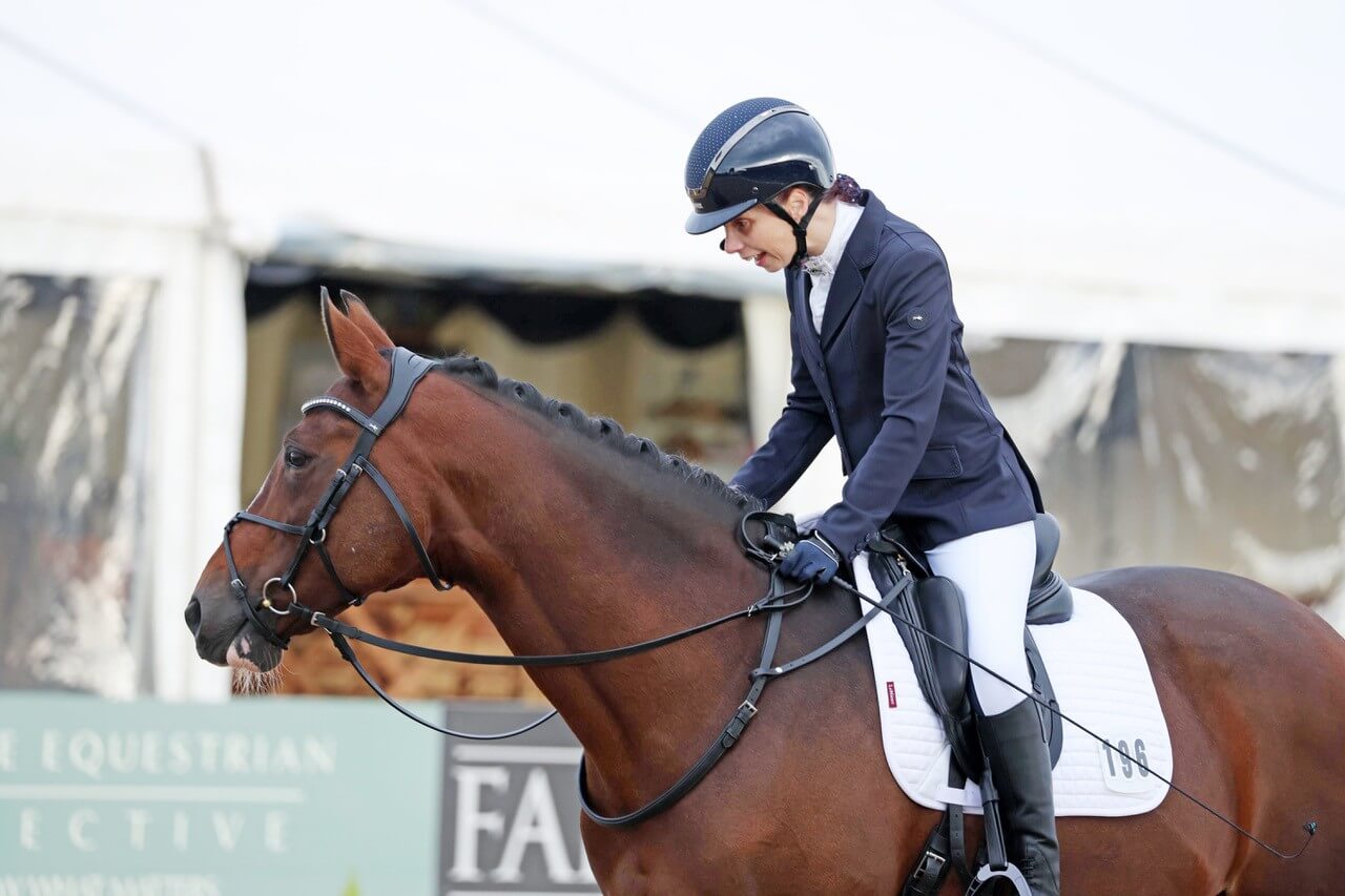 Flis Marriott riding Seran in a dressage arena