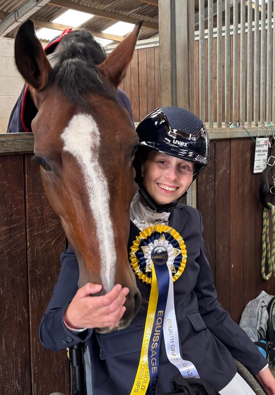 Flis Marriott with horse Seran and a gold rosette