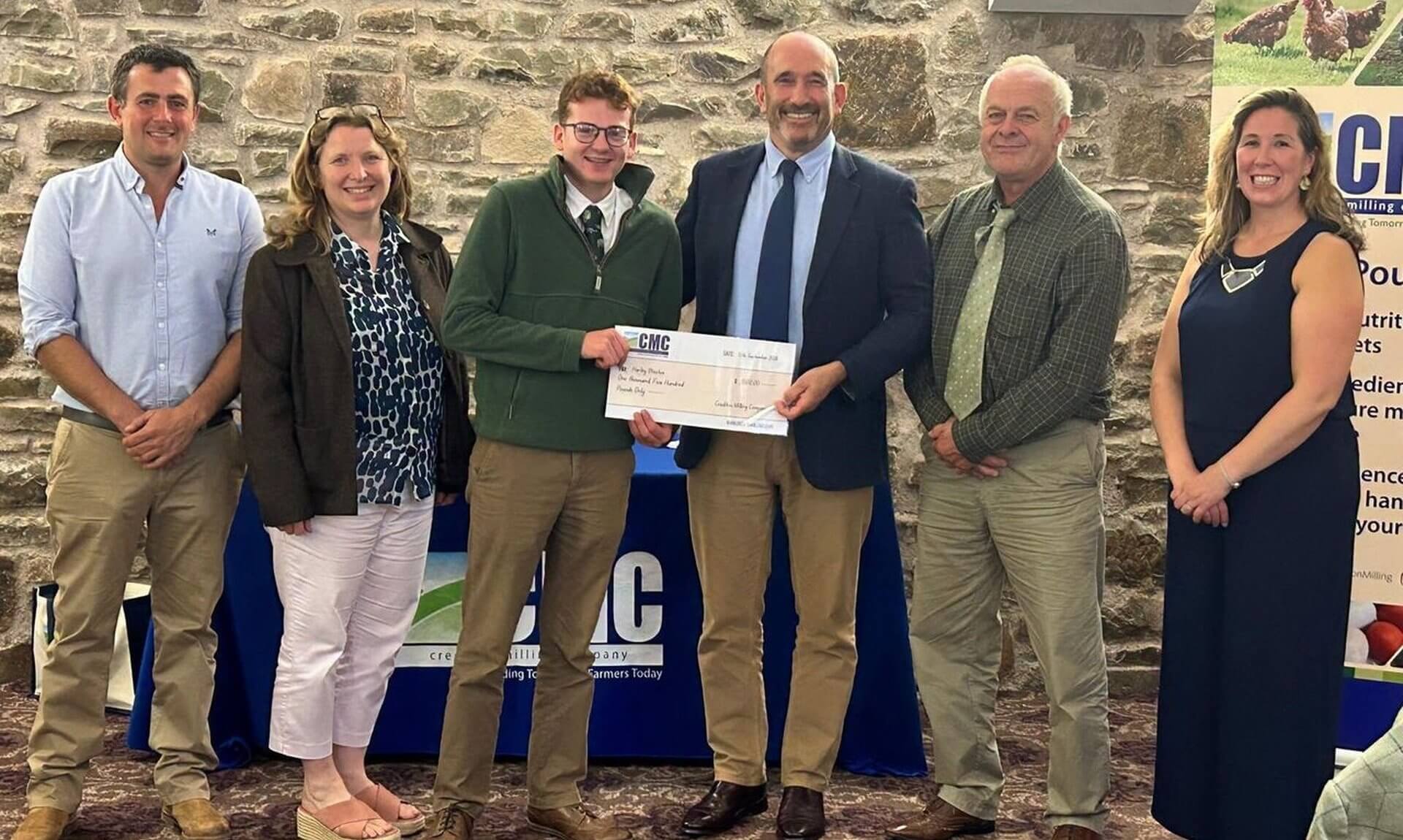 Harley Weston holding a Crediton Milling cheque at the Farm Business Apprentice 2026 Award ceremony