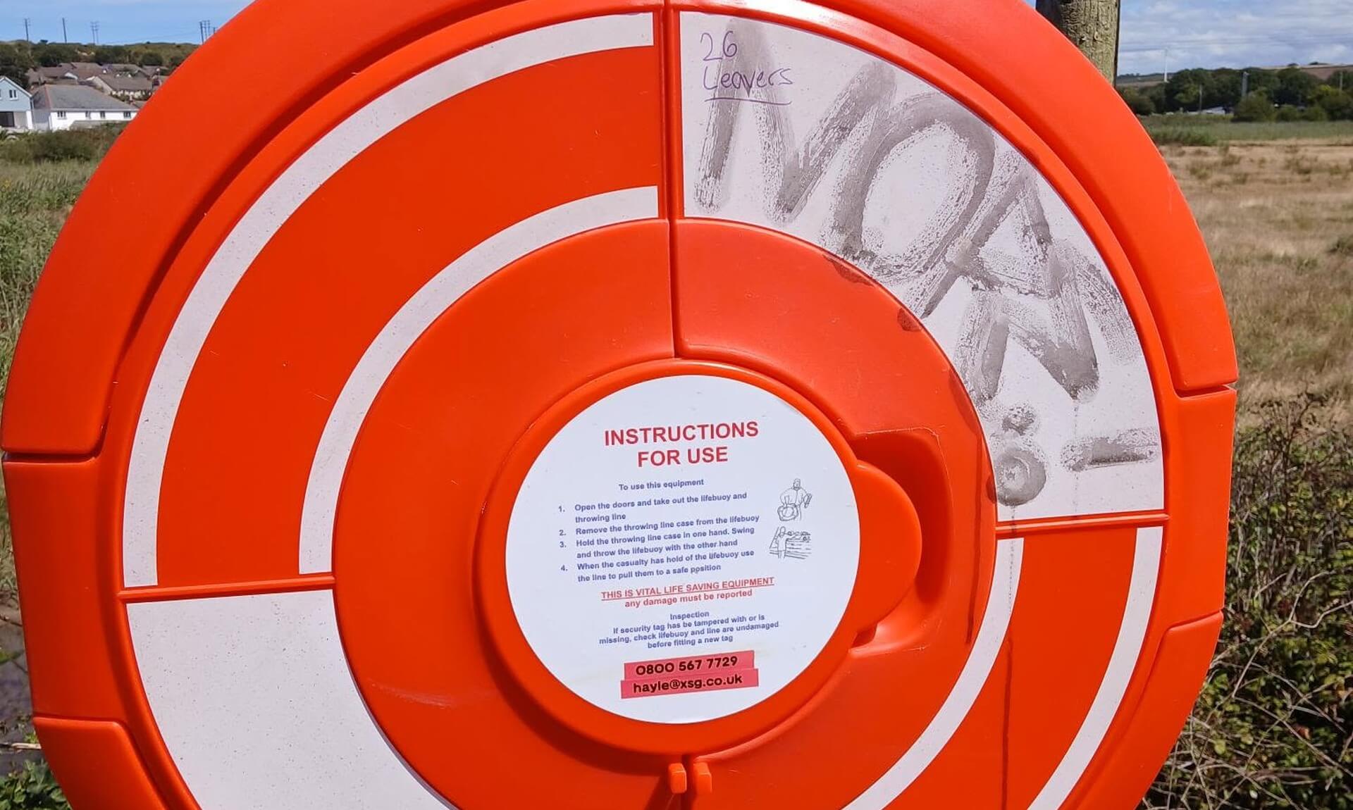Vandalised lifebuoy station on Black Bridge, Hayle, with graffiti and no ring inside