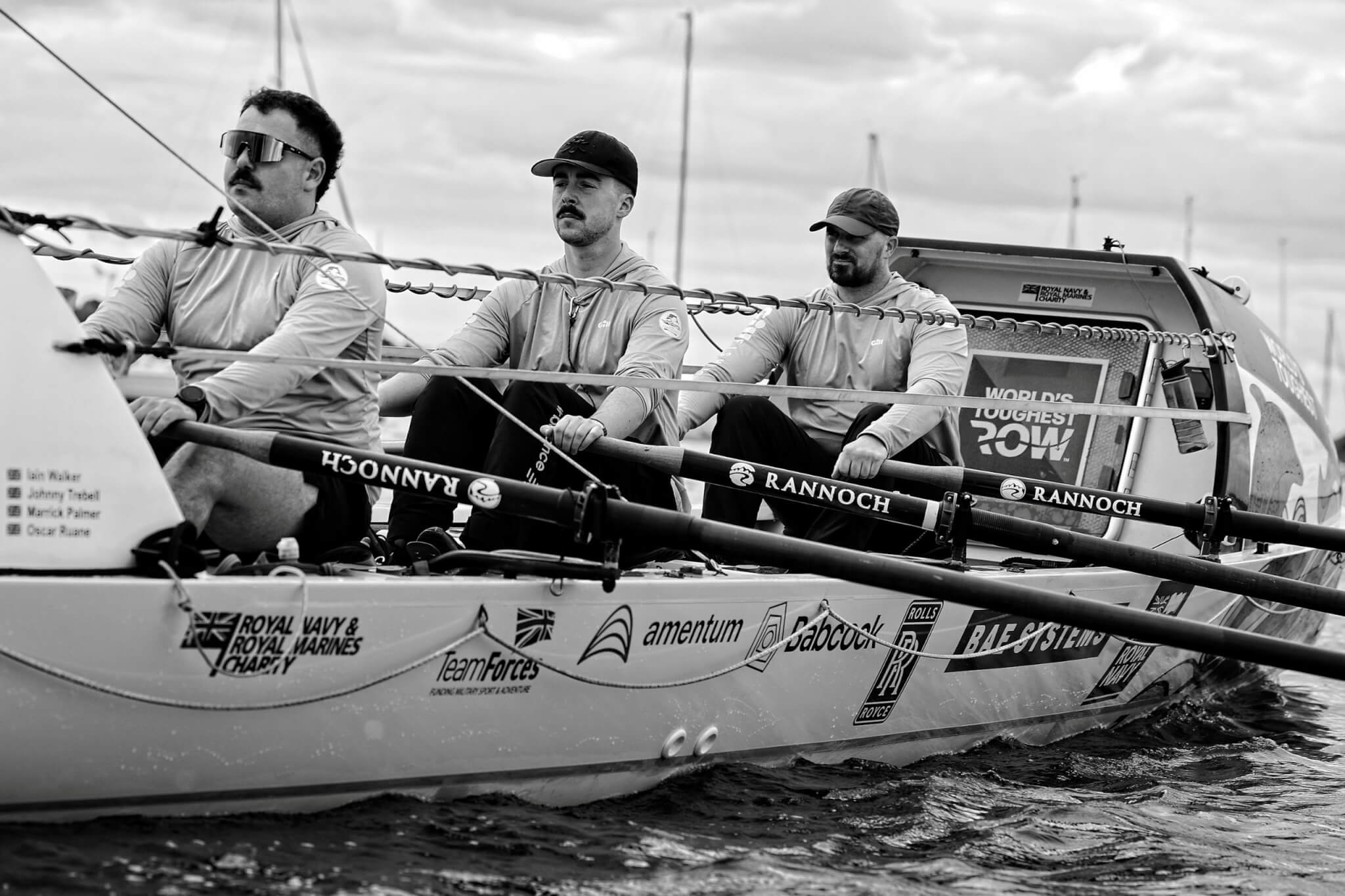 Black and white shot of the crew rowing