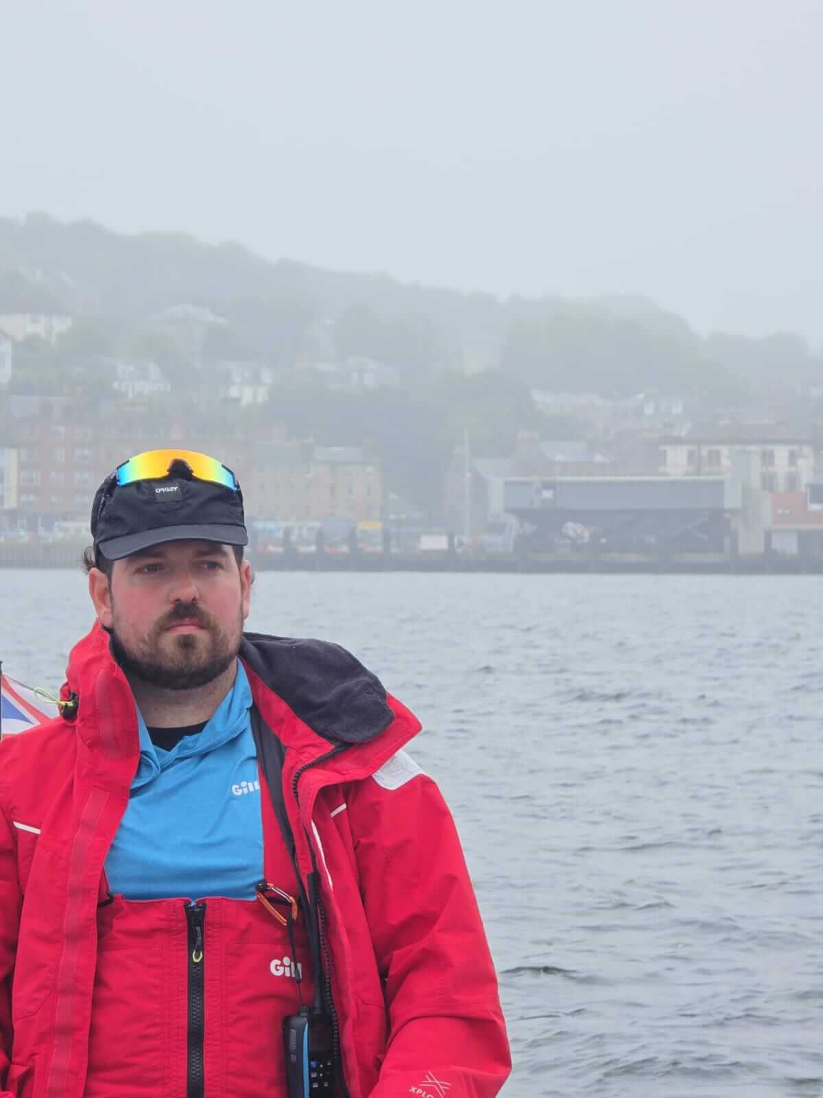 HMS Oardacious crew member in a harbour
