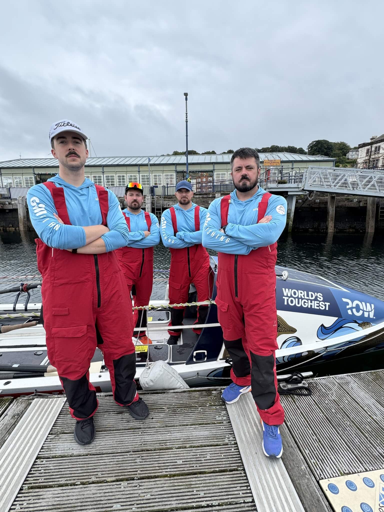 The four HMS Oardacious crew on a pontoon