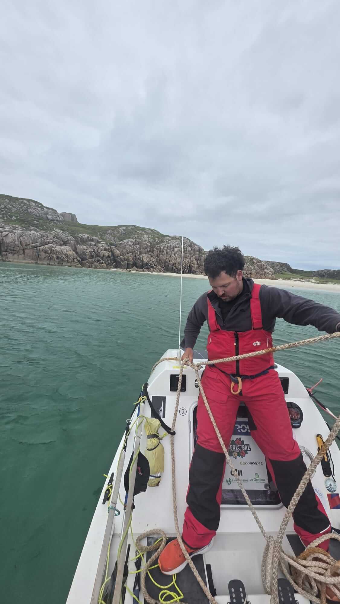 Crew member handling ropes on the boat
