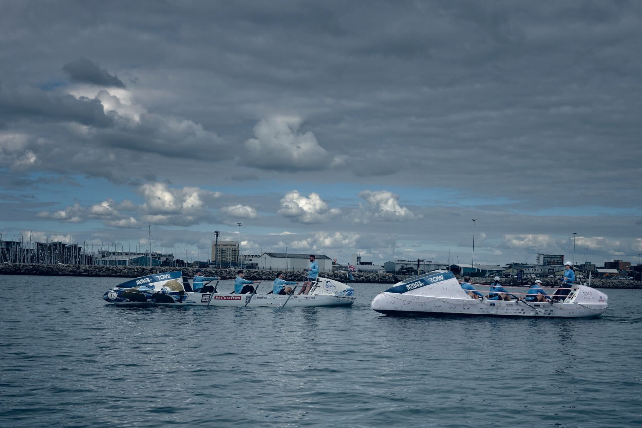 Two ocean rowing boats training together