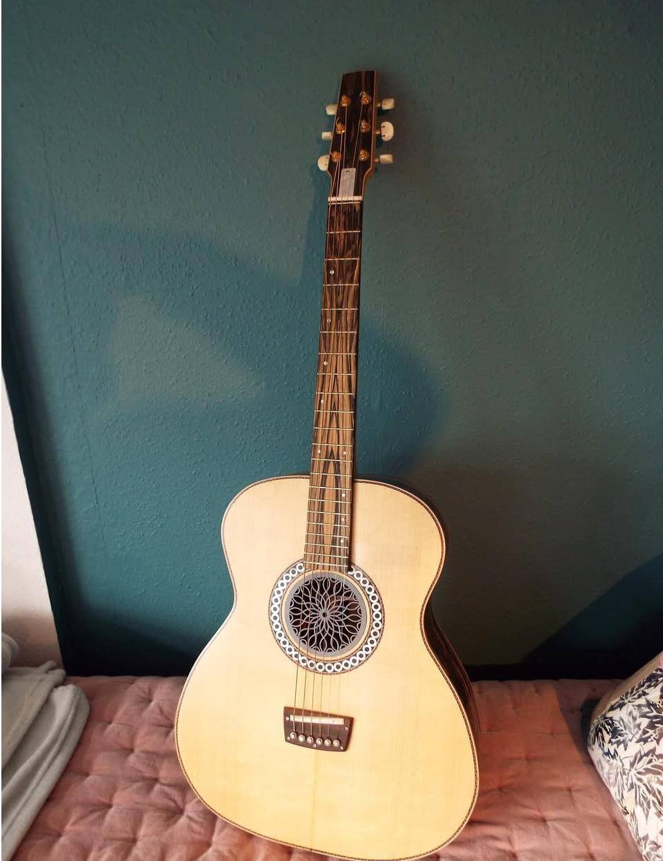 Kif Wood's handmade acoustic guitar, front view showing the fretboard and rosette