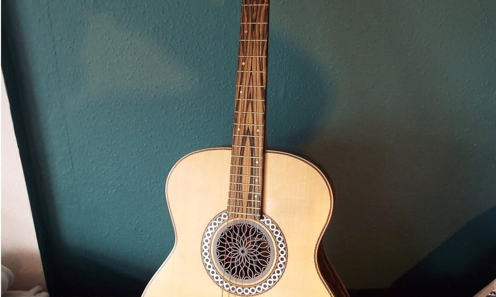 Kif Wood's handmade acoustic guitar, front view showing the fretboard and rosette