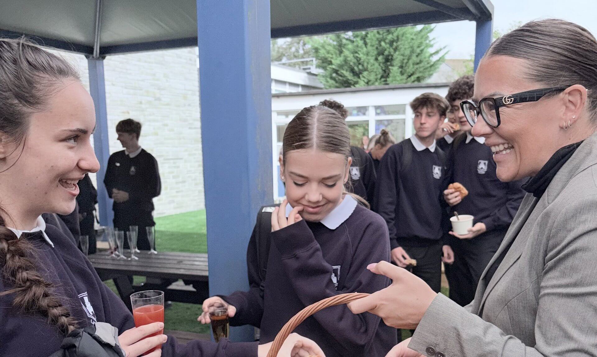 Head of School Linda Blackburn offers pastries to students at the opening of The Pavilion at Launceston College