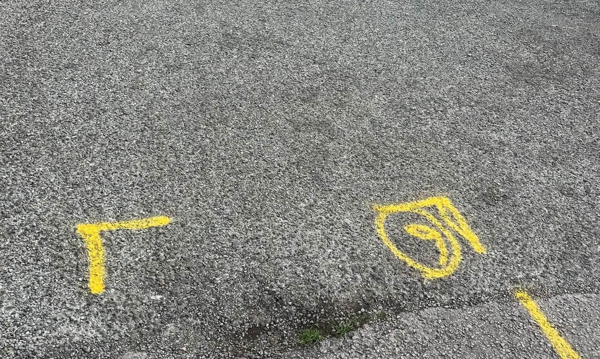 Yellow paint markings on the tarmac at Millbrook car park ahead of resurfacing