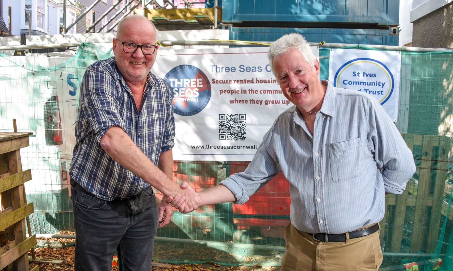Simon Ryan from Three Seas Cornwall and Matthew Hayter shaking hands outside the Old Vicarage in St Ives