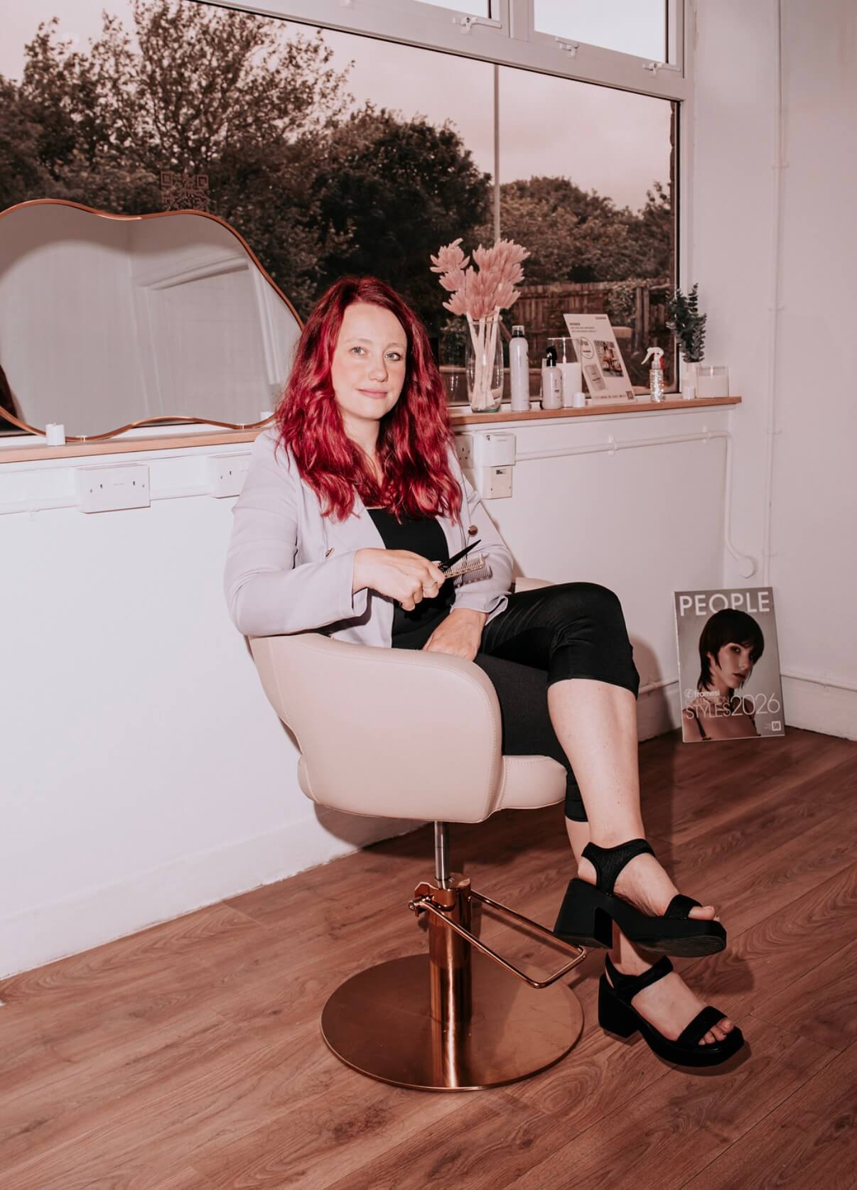 Olivia, owner of The Liv Bridal Hair Studio, in her Redruth studio