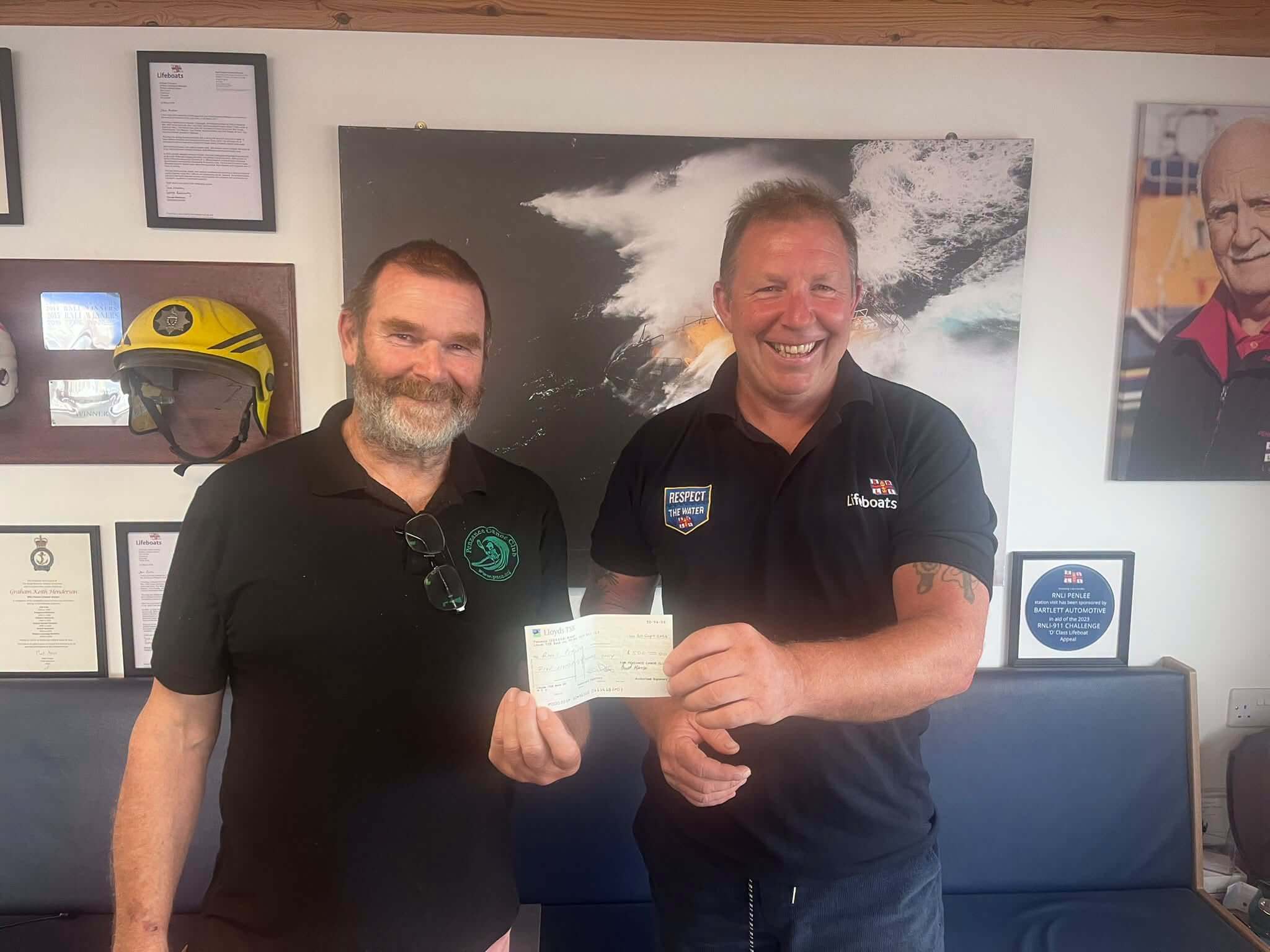 Richard Uren presenting a cheque to Penlee RNLI on behalf of Penzance Canoe Club