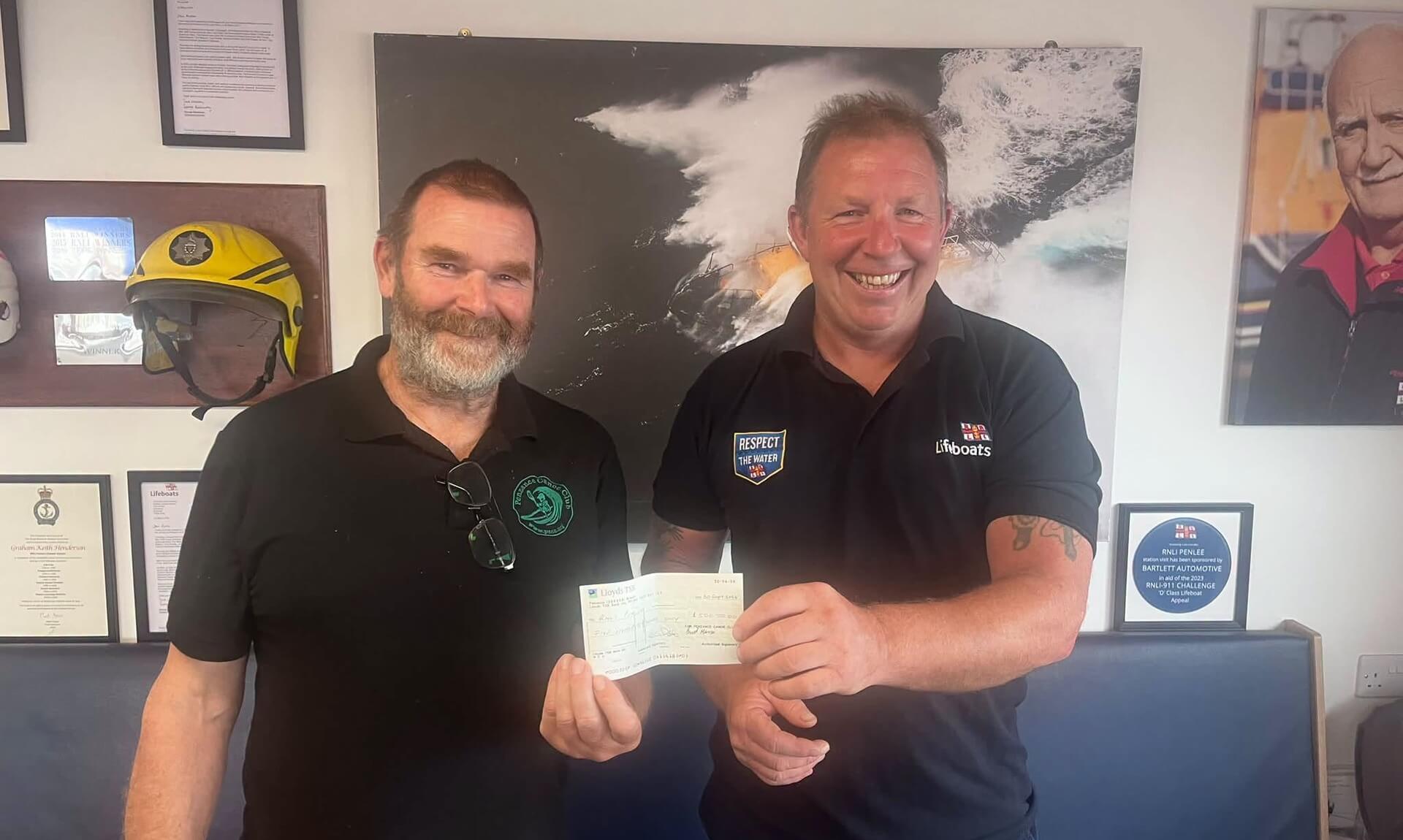 Richard Uren presenting a cheque to Penlee RNLI on behalf of Penzance Canoe Club