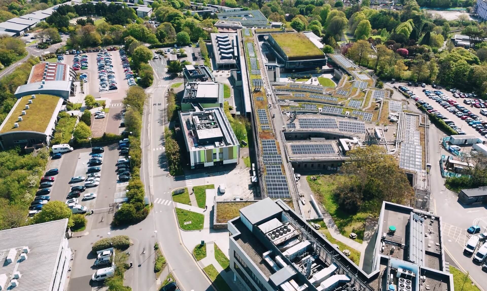Aerial view of Penryn Campus showing rooftop solar panels and green roofs