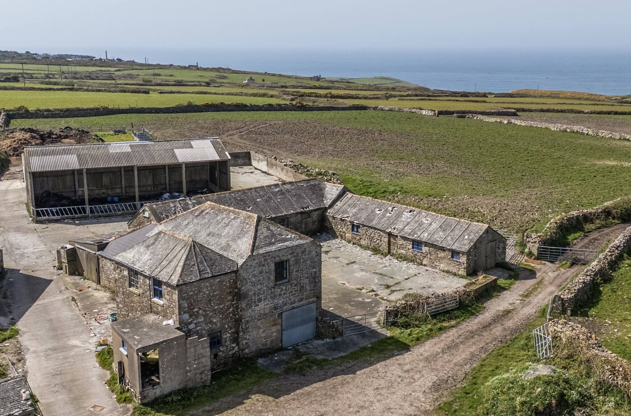 Aerial view of the granite barns at Portheras Farm Buildings, Pendeen