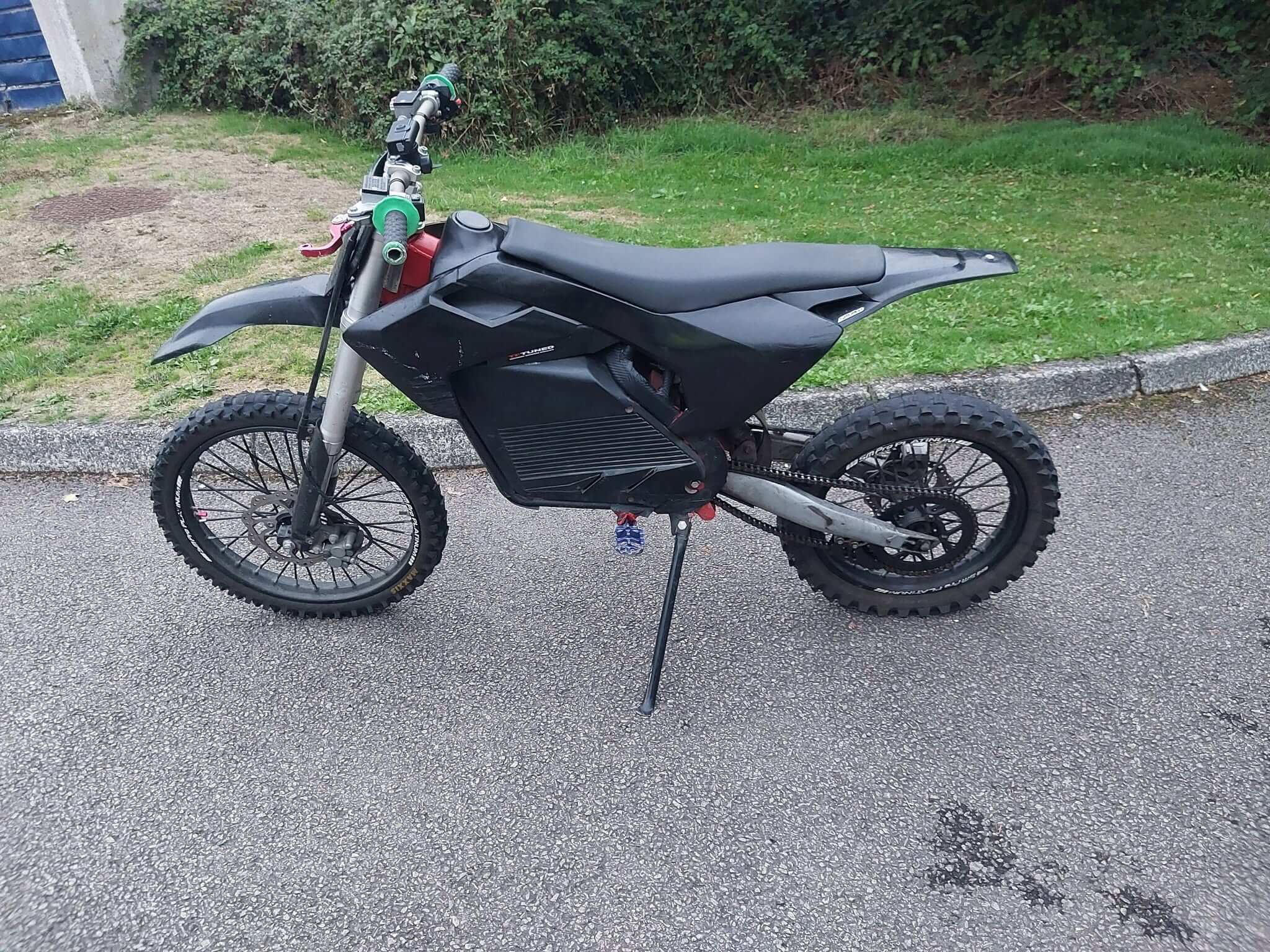 Side view of the seized Surron style electric bike