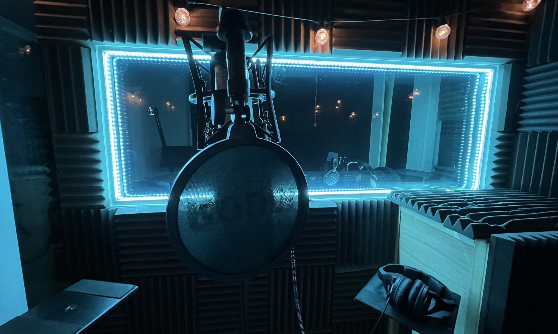 The Studios Newquay recording booth, wrapped in acoustic foam and neon trim