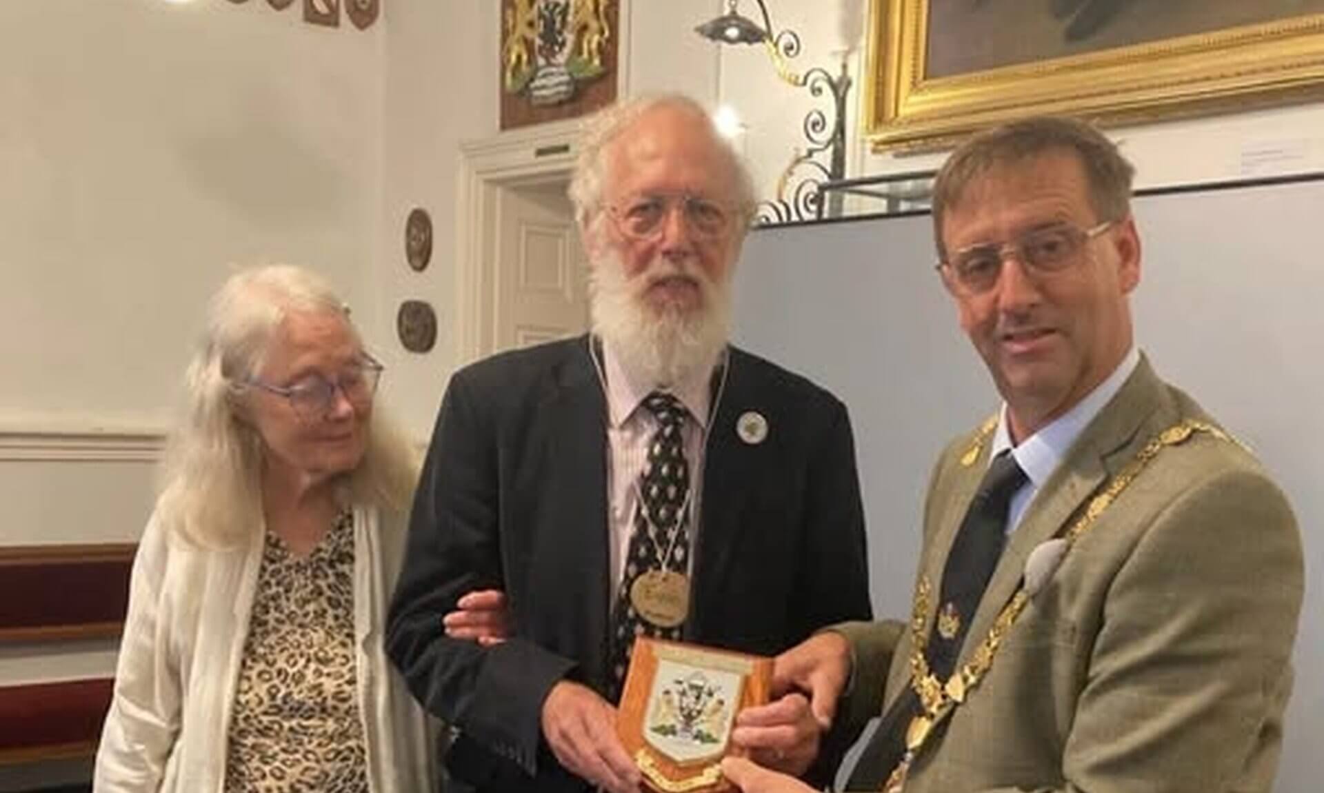 Mayor of Falmouth Cllr Alan Jewell presents Euan McPhee with a Falmouth Town Council plaque