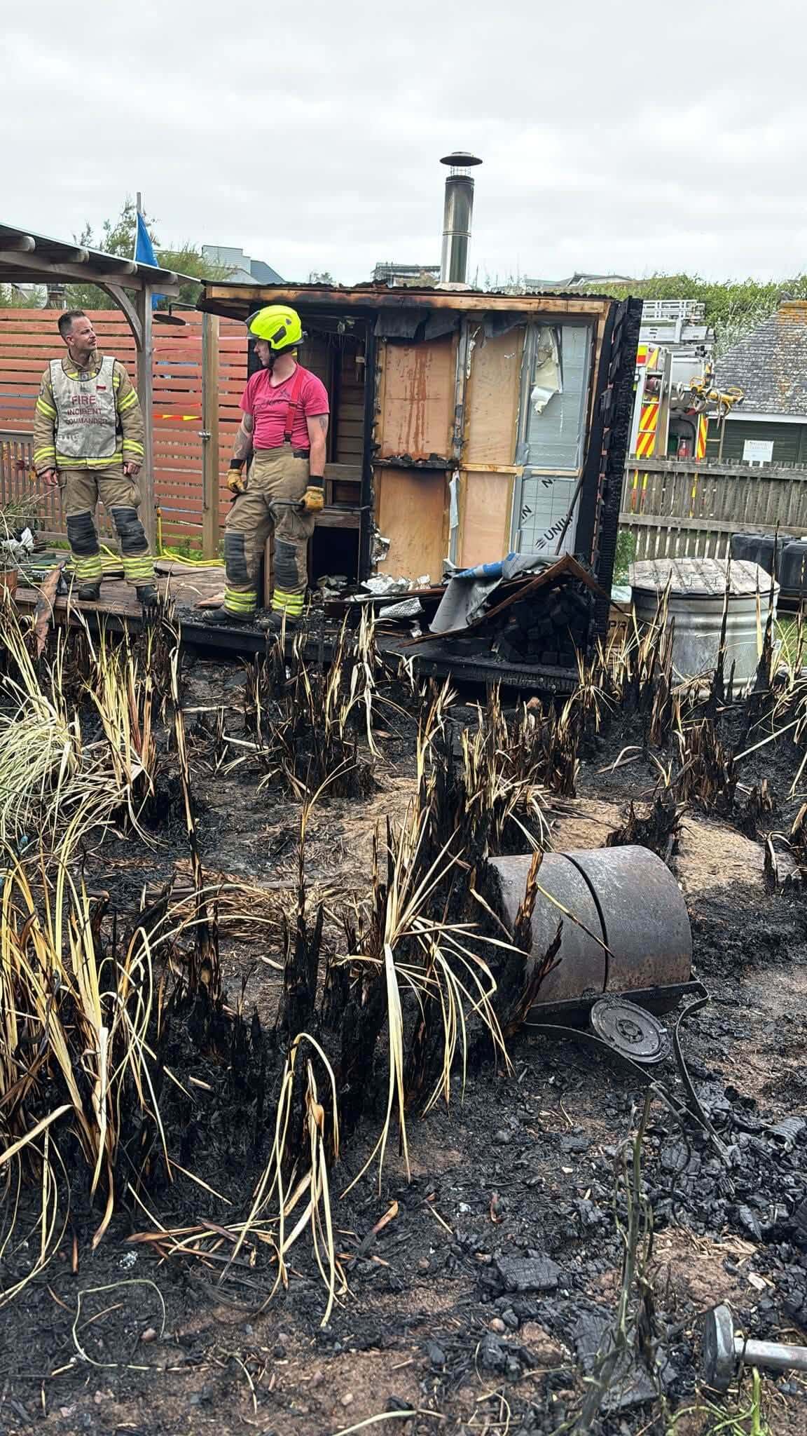 Fire crew at the aftermath of a beach cabin fire