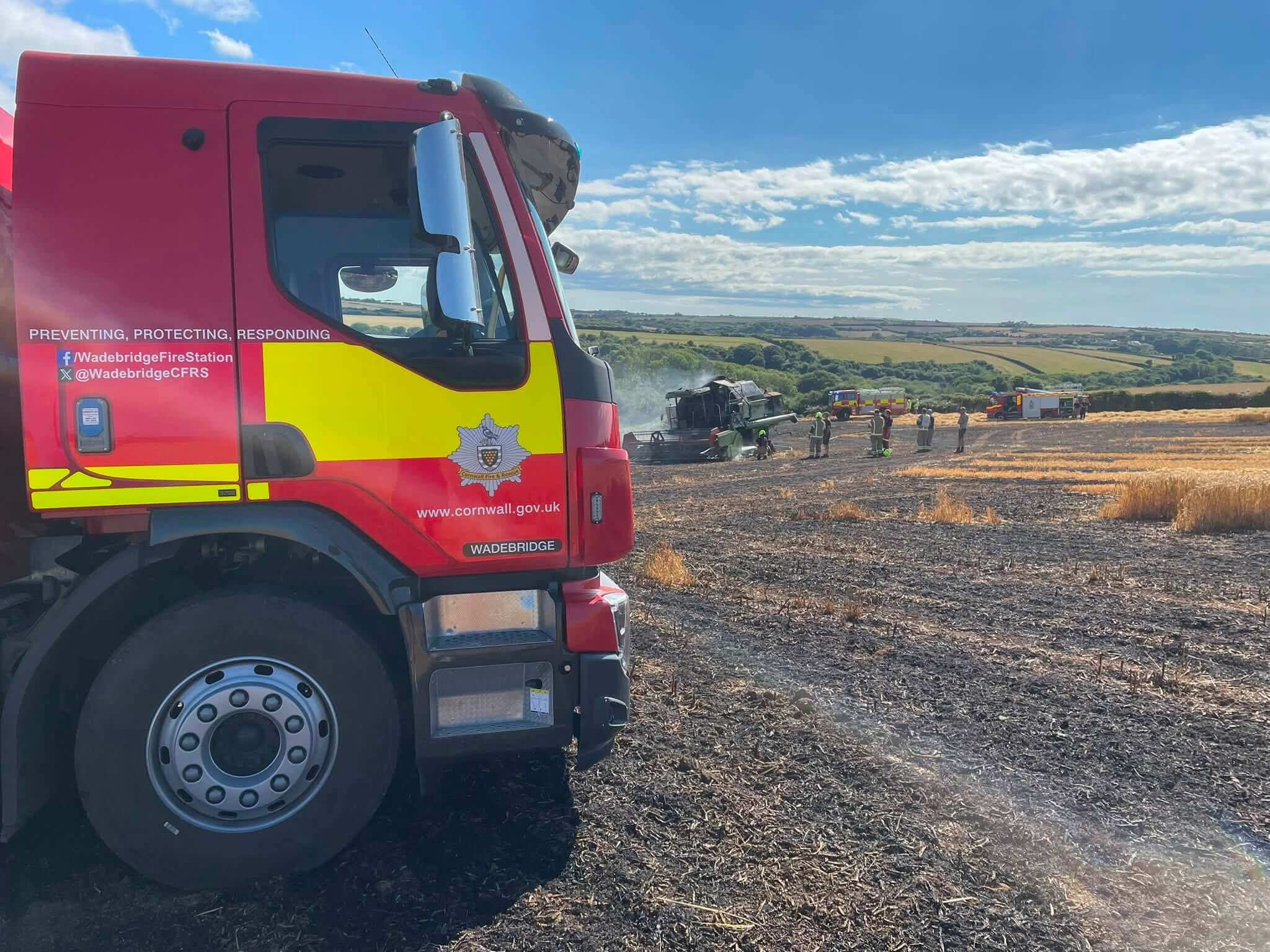 Wadebridge fire engine at the scene of a combine harvester fire in a Cornish field