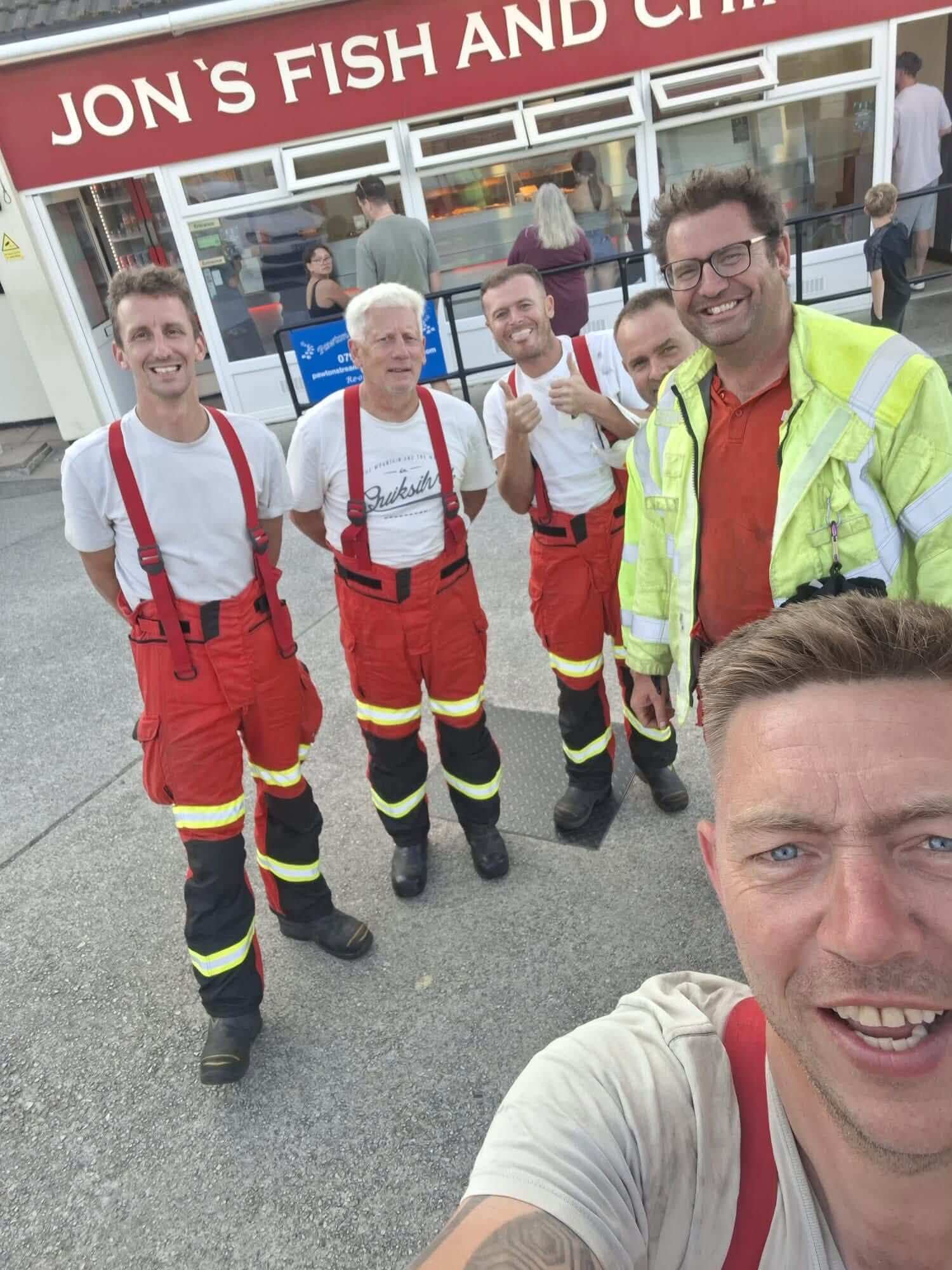 Wadebridge firefighters with fish and chips after a shout
