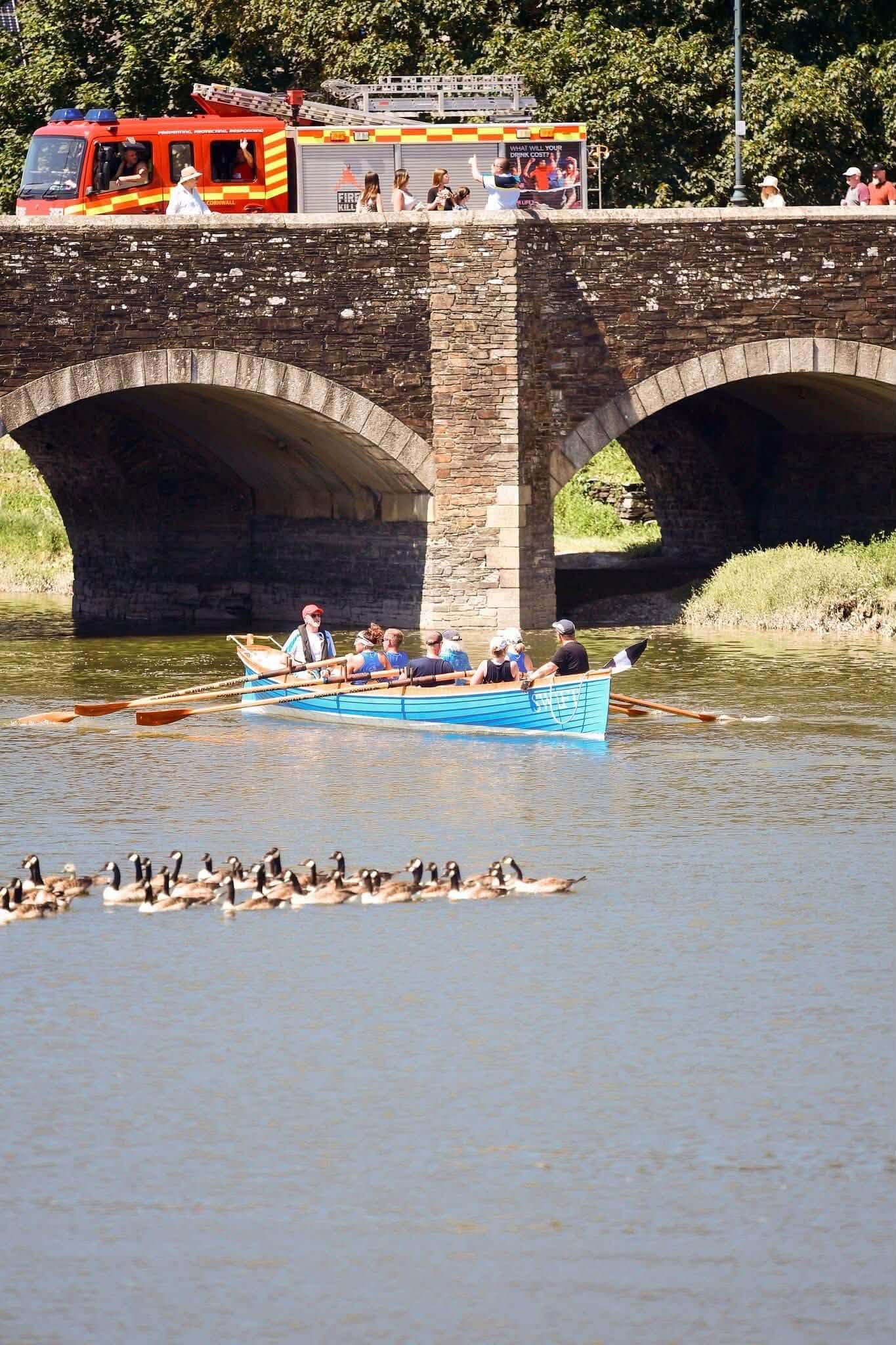 Fire engine crossing Wadebridge bridge during the raft race