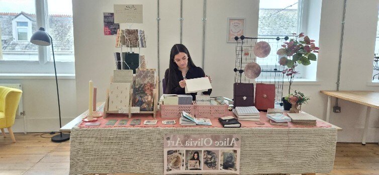 Alice Nimmo demonstrating book binding