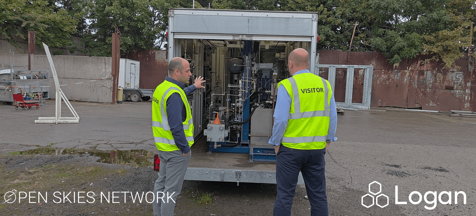 Louis Gardner and Ahmad El-kharouf inspecting hydrogen equipment inside the trailer