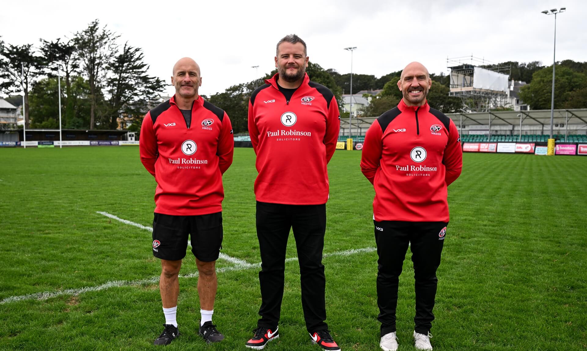 Adam Brooks with Cornish Pirates head coaches Gavin Cattle and Alan Paver on the pitch at the Pirates' ground