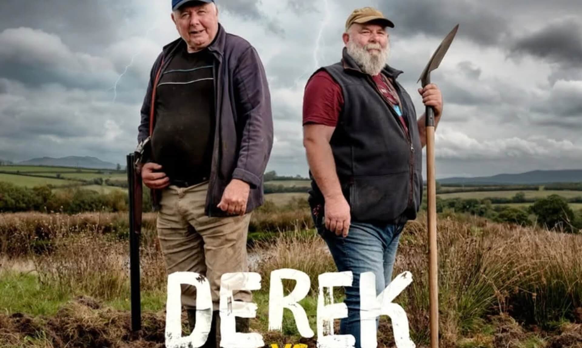 Derek Banbury and Derek Gow standing in a Devon field under a stormy sky