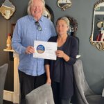 Ray and Flory Veerman holding Flory Restaurant's 2026 Taste of the West Gold Award