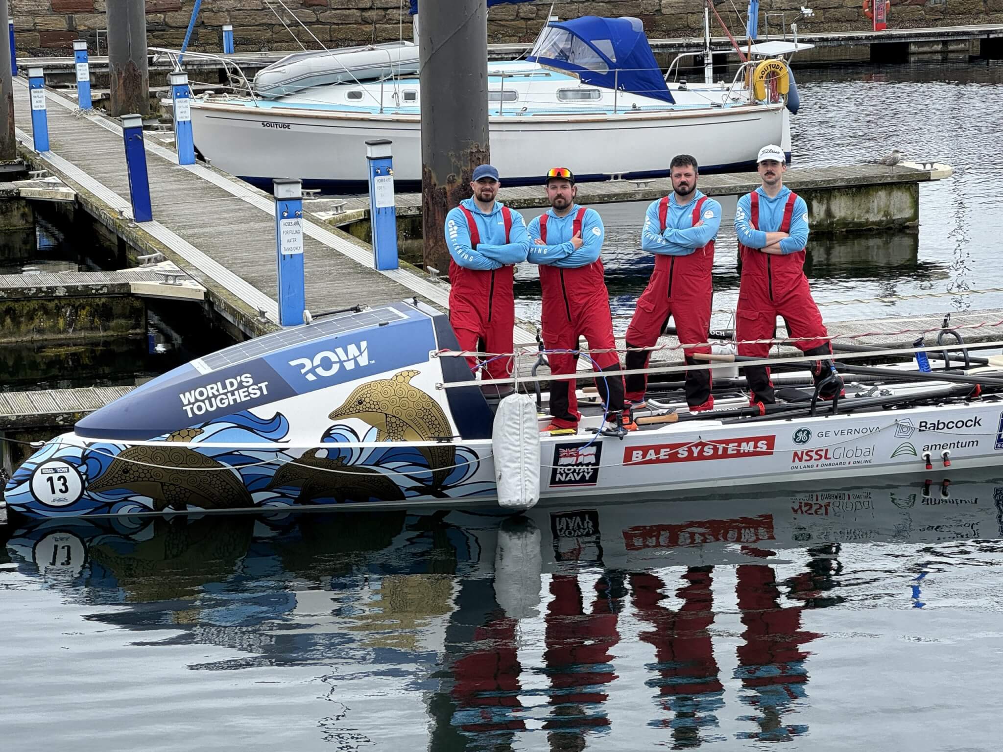 The crew standing on boat number 13