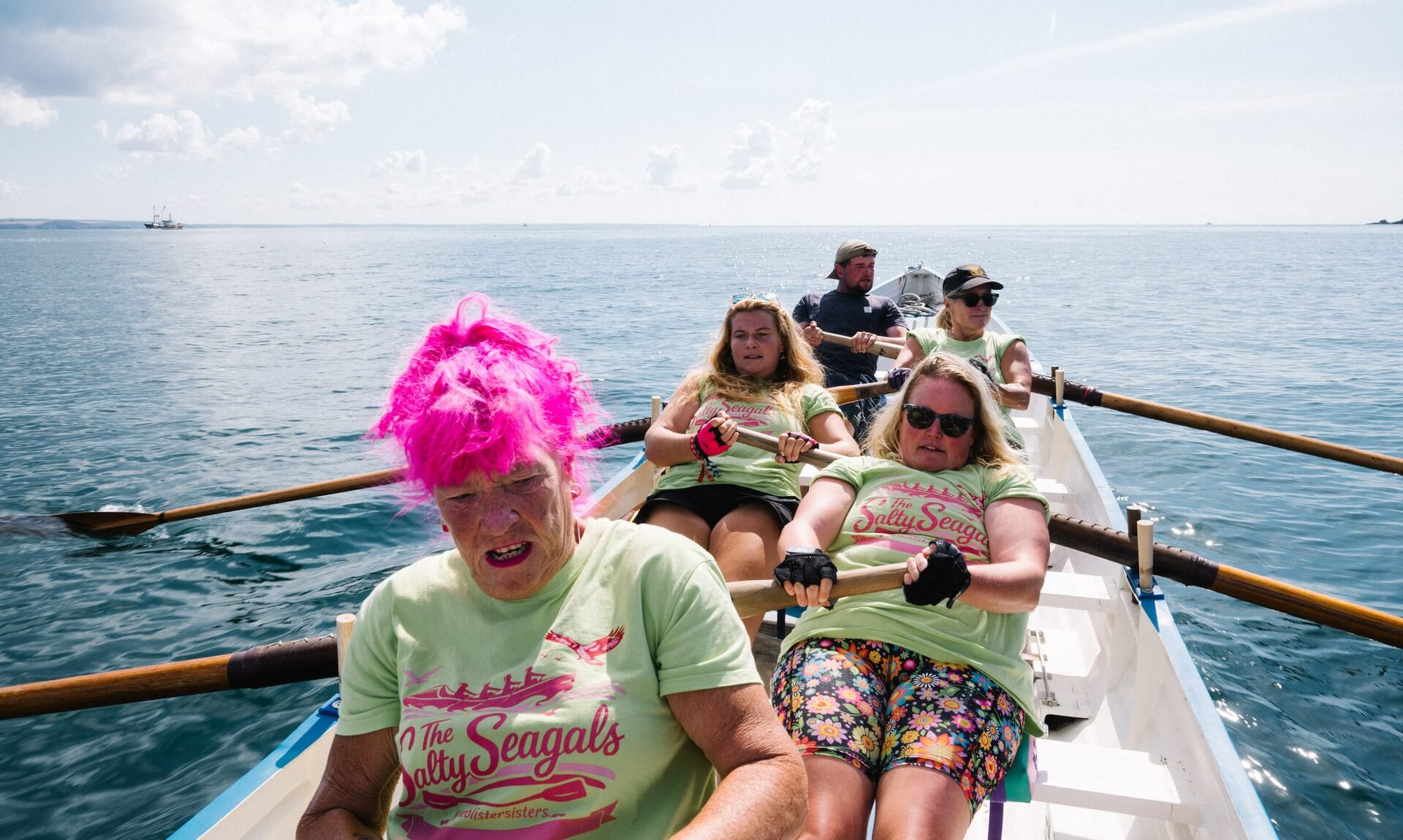 The Salty Seagals crew rowing a Cornish pilot gig out to sea